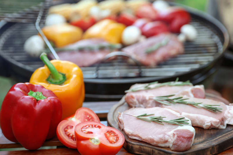 Fresh food in front of a grill